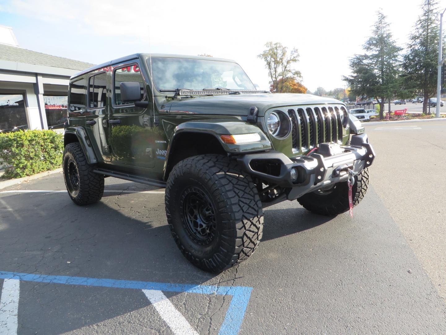 2021 Sarge Green /BLACK Jeep Wrangler Unlimited Sahara 4XE 4d SUV 4wd (1C4JJXP6XMW) with an 2.0L I4 DOHC DI Turbo PHEV engine, 8-speed Automatic transmission, located at 2630 Grass Valley Highway, Auburn, CA, 95603, (530) 508-5100, 38.937893, -121.095482 - 4XE Sahara with a Teraflex suspension system, Falcon shocks, 17" Fuel Offroad wheels, and 37" Nitto Ridge Grappler tires. - Photo#2